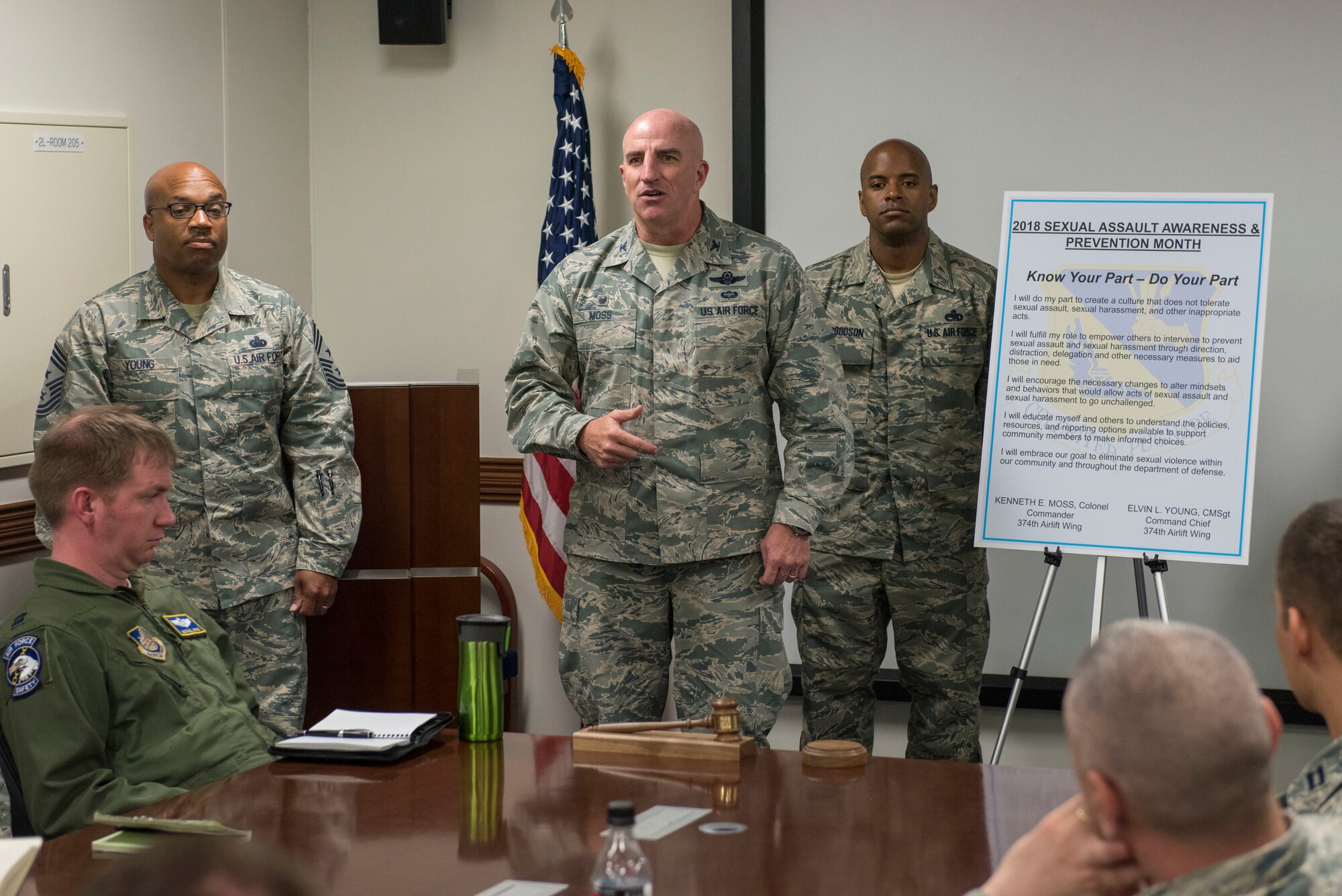 Col. Kenneth E. Moss, 374th Airlift Wing commander, takes a moment to encourage those in attendance to take the Sexual Assault Awareness & Prevention Month proclamation at Yokota Air Base, Japan, April 3, 2018.