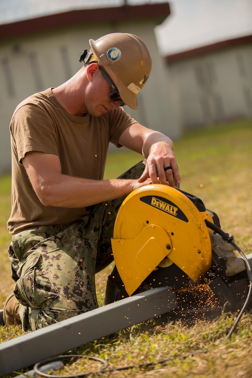 Seabees help marines for the Medal of Honor Hospital Corpsman 3rd Class Bush Battle Aid Station for the Correctional Custody Unit 2.0 program March 28 aboard Camp Hansen, Okinawa, Japan.