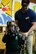 U.S. Air Force Tech Sgt. Cody Williams, 100th Civil Engineer Squadron Fire Department station captain, helps a young student from Great Heath Academy try on firefighter equipment in Mildenhall, England, March 27, 2018. The firefighters showed the children what their gear is used for, explained how it protects them, and allowed the children to try on the gear. (U.S. Air Force photo by Airman 1st Class Alexandria Lee)