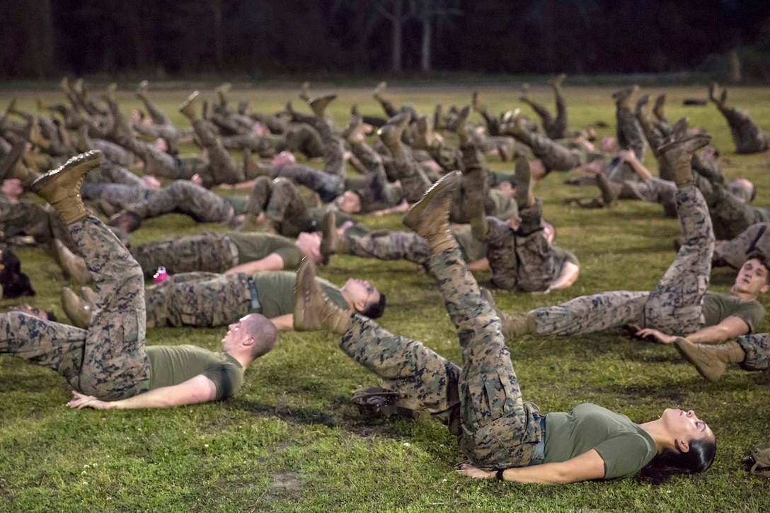 Marines and sailors perform the flutter kicks.