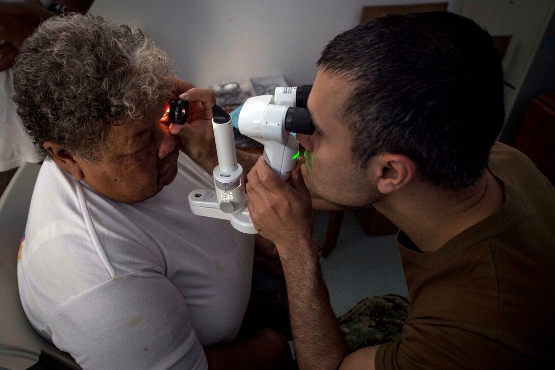 A patient gets an eye examination.