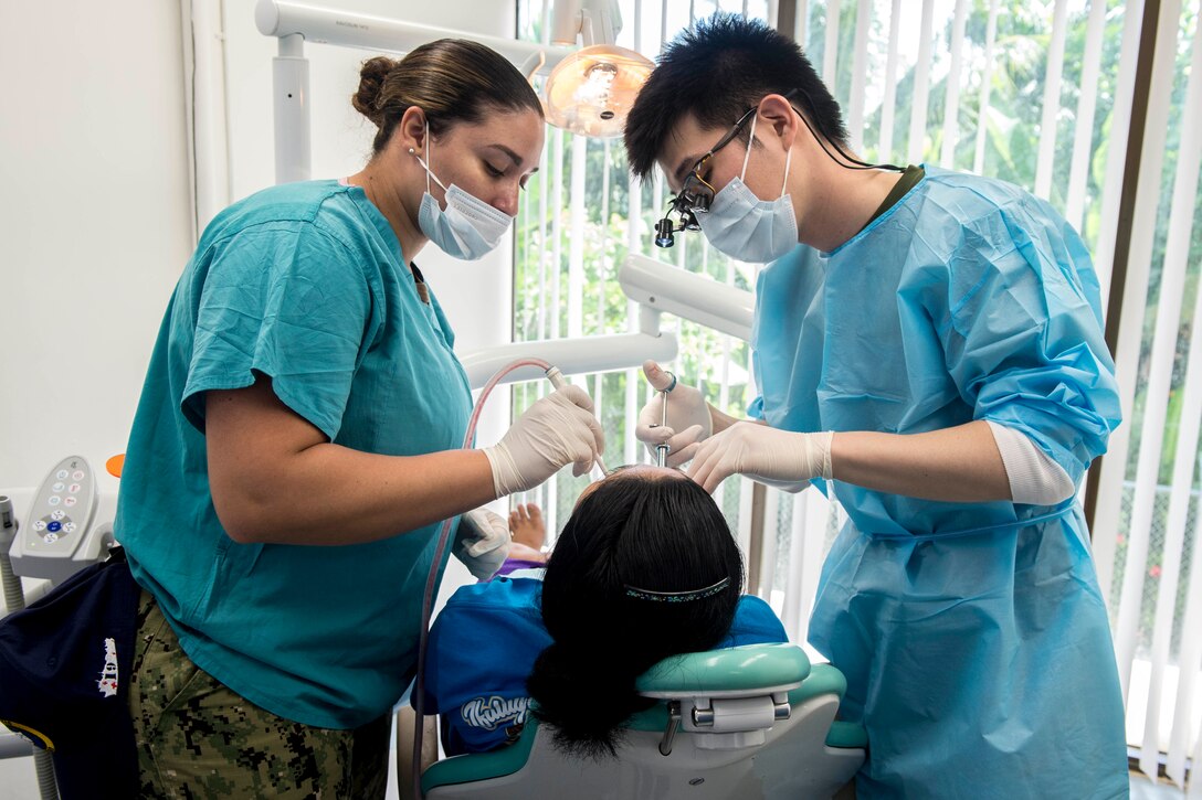 A patient has a tooth removed.