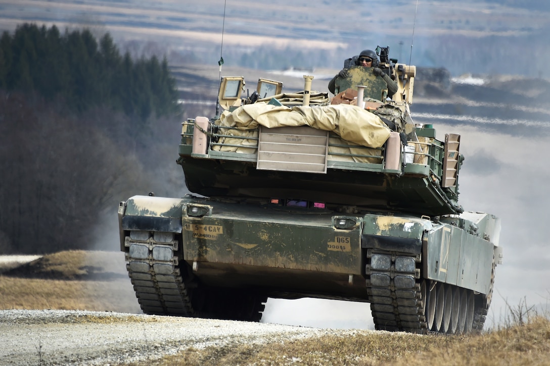 Soldiers maneuver an M1A1 Abrams tank off the range.