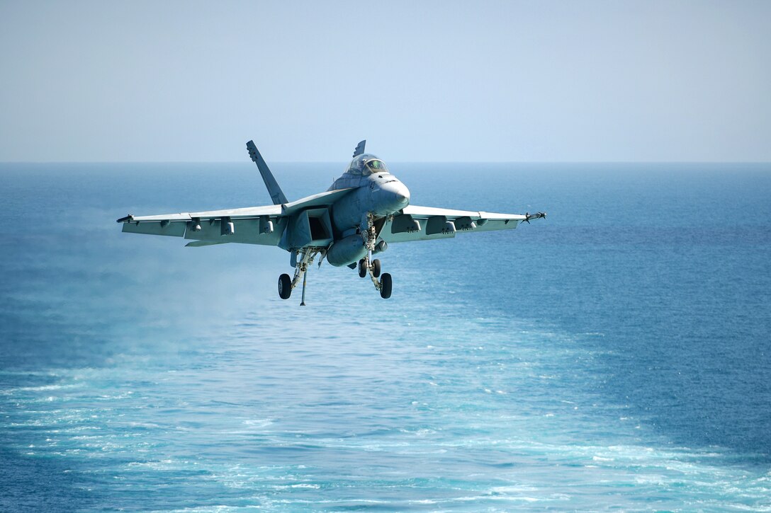 An F/A-18F Super Hornet aircraft prepares to land.