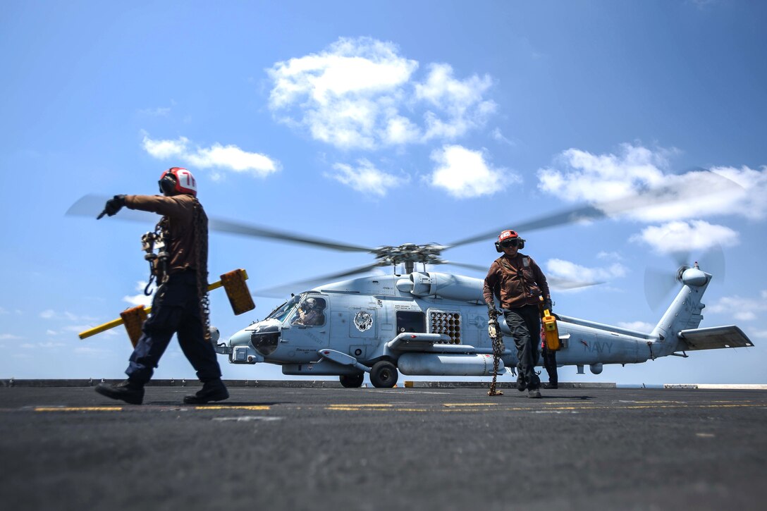 An MH-60R Sea Hawk helicopter prepares for takeoff.