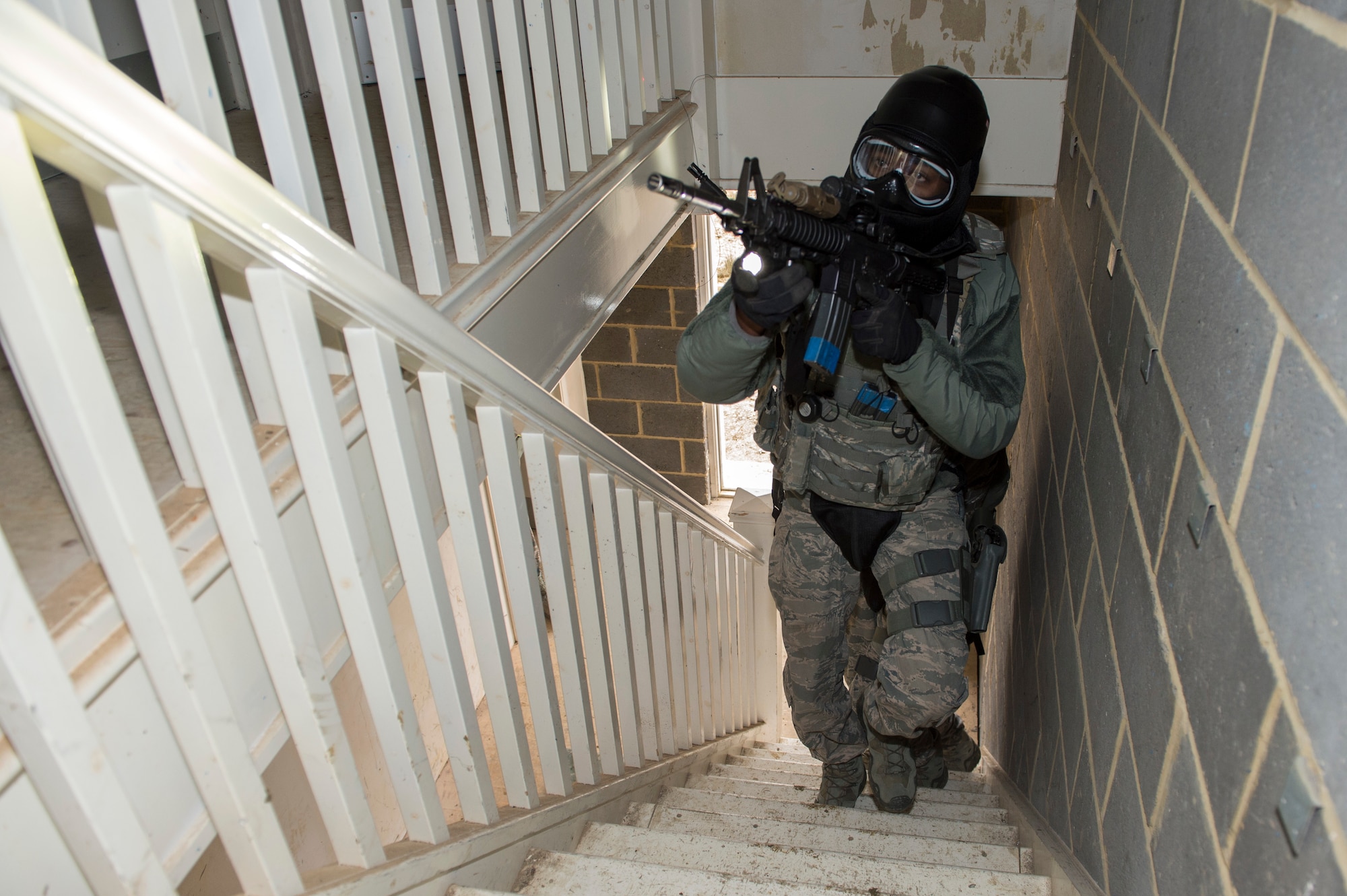 Airmen with the 422nd Security Forces Squadron participate in a force on force exercise at Bicester Garrison, United Kingdom, March 29, 2018. The urban warfare exercise was designed to enhance and sharpen Airmen’s house clearing techniques. (U.S. Air Force photo by Senior Airman Chase Sousa/Released)