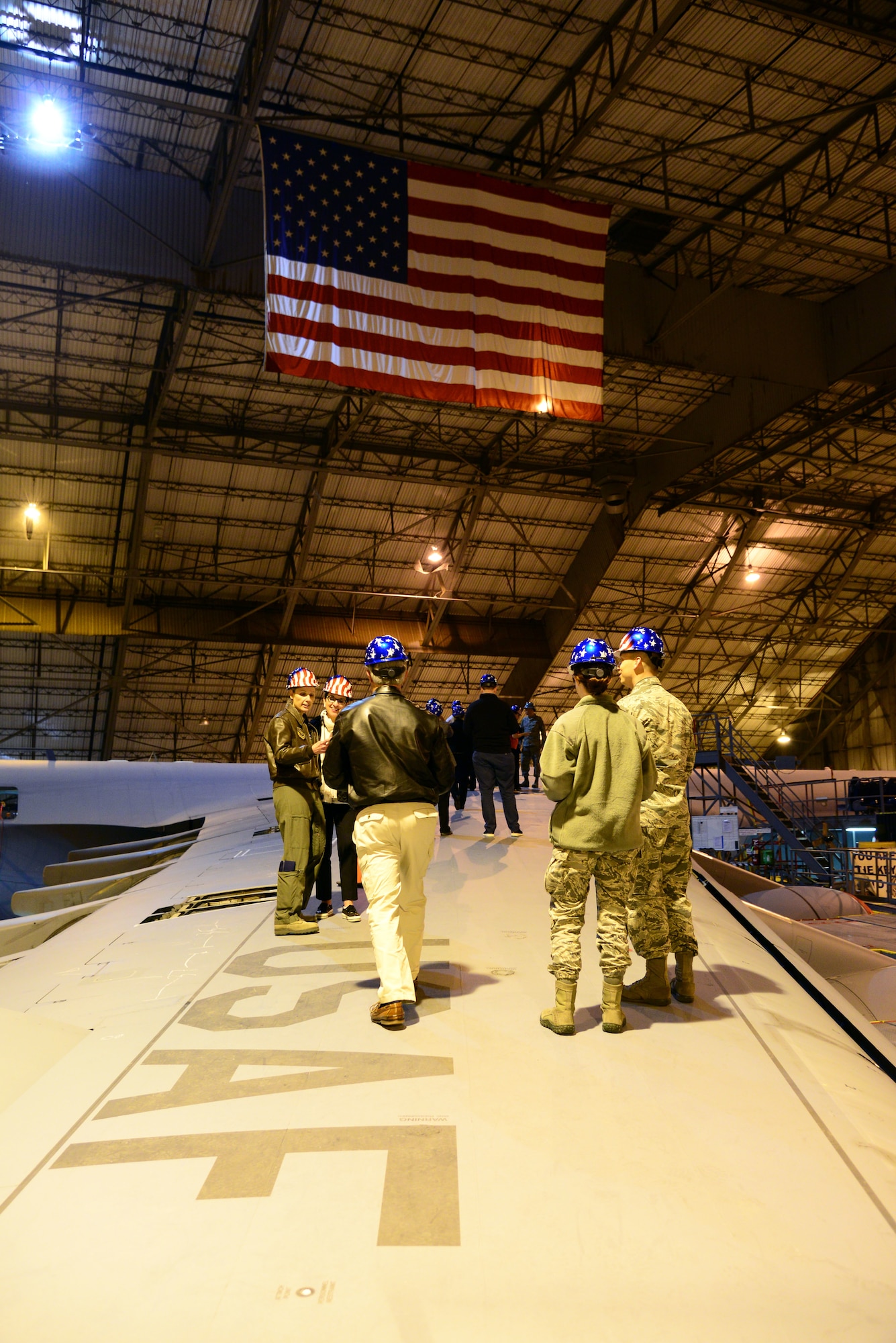 Civic leaders from MacDill Air Force Base, Fla. tour the isochronal inspection dock at Dover Air Force Base, Del. March 28, 2018. Airmen from the 436th Maintenance Group brief the group on the procedures and policies of the ISO dock. (U.S. Air Force Photo by Staff Sgt. Aaron Jenne)