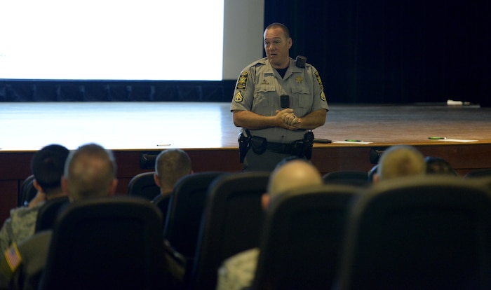Deputy Brent Roy from the Charleston Sheriff Department’s traffic unit, delivers a speech during the annual motorcycle safety briefing at the Air Base Theater March 30, 2018.