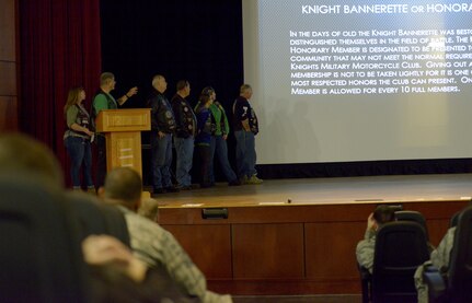 The 37th Chapter of Green Knights read the power point slide on honorary members during the annual motorcycle rider’s safety briefing at the Air Base Theater March 30, 2018.