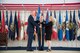 Brig. Gen. Evan Dertien, 96th Test Wing commander, hands the 96th Range Group guidon to the unit’s new director, Jeri McClung during a March 28 ceremony at Eglin Air Force Base, Fla. McClung is no stranger to the group, having served in various within as well as outside the organization. The 96th RG is responsible for the planning and execution of flight, ground and laboratory test missions. (U.S. Air Force Photo/Jasmine Porterfield)