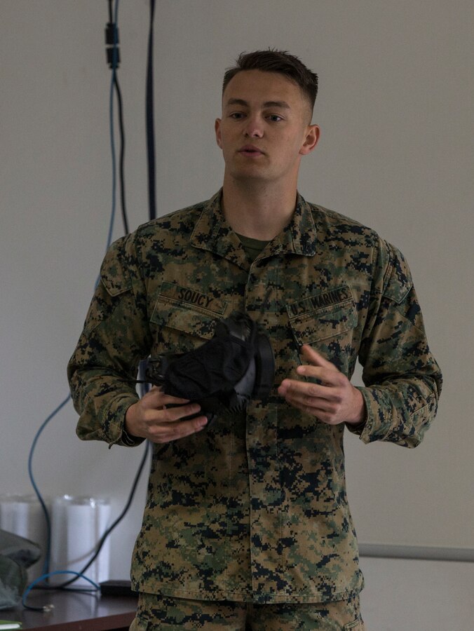 Lance Cpl. Anthony Soucy, a chemical, biological, radiological and nuclear defense specialist with 3rd Marine Aircraft Wing, teaches the M50 Field Protective Mask class during the reconnaissance, surveillance and decontamination course at Marine Corps Air Station Miramar, Calif., March 25. The course is designed to train unit personnel in the procedures and equipment used in accomplishing RS&D operations in a chemical, biological, radiological or nuclear environment. (U.S. Marine Corps photo by Lance Cpl. Clare J. McIntire/Released)
