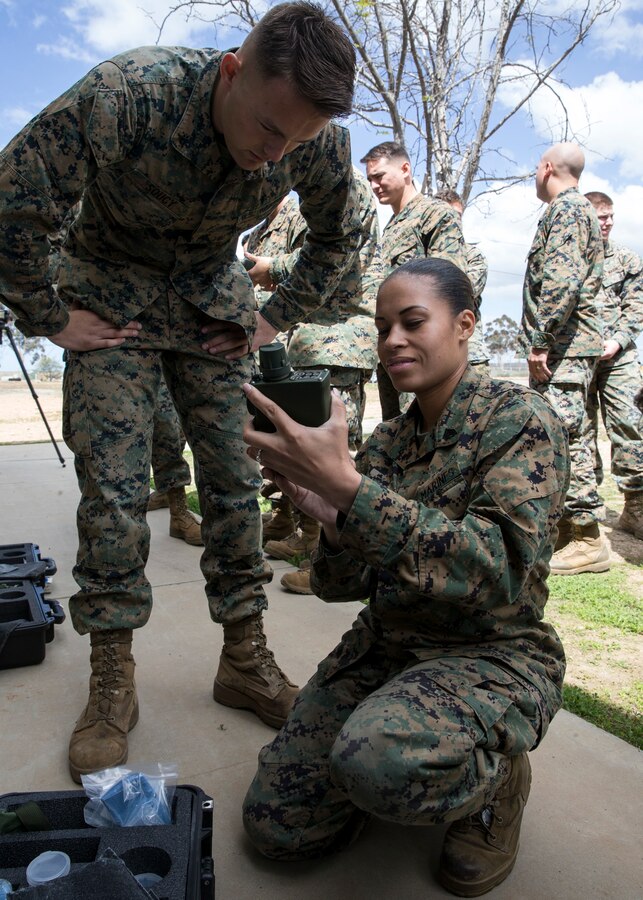 Sgt. Charnelle Smith, right, a combat videographer with 3rd Marine Aircraft Wing, operates a Joint Chemical Agent Detector during the reconnaissance, surveillance and decontamination course at Marine Corps Air Station Miramar, Calif., March 25. The course is designed to train unit personnel in the procedures and equipment used in accomplishing RS&D operations in a chemical, biological, radiological or nuclear environment. (U.S. Marine Corps photo by Lance Cpl. Clare J. McIntire/released)