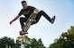 U.S. Air Force Airman 1st Class Nick Whitehurst, 633rd Communications Squadron client systems technician, nose-grabs his skateboard in Smithfield, Va., July 26, 2017.