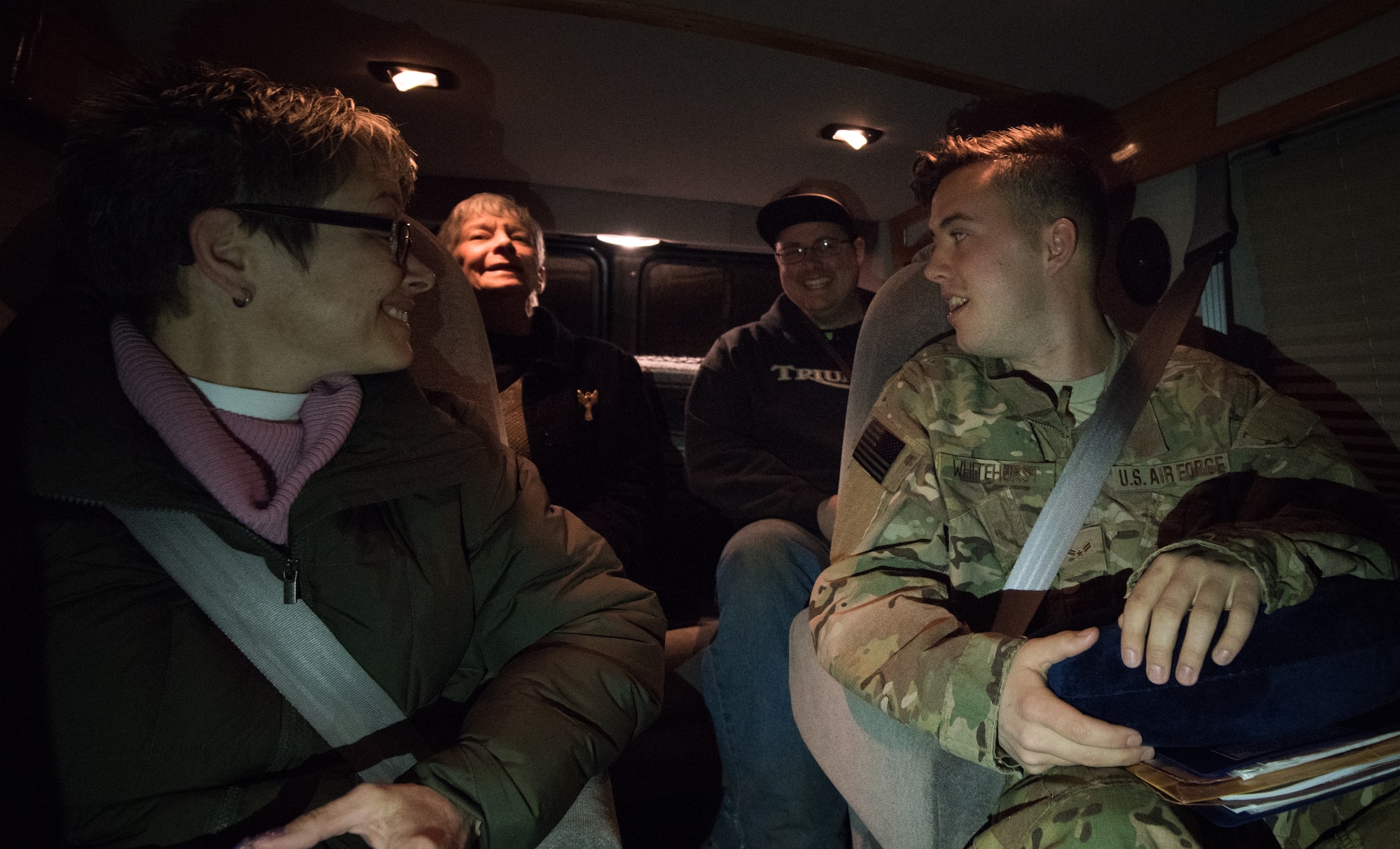 U.S. Air Force Airman 1st Class Nicholas Whitehurst, 633rd Communications Squadron client systems technician, jokes around with his family on their drive to the airport in Hampton, Virginia, March 27, 2018.