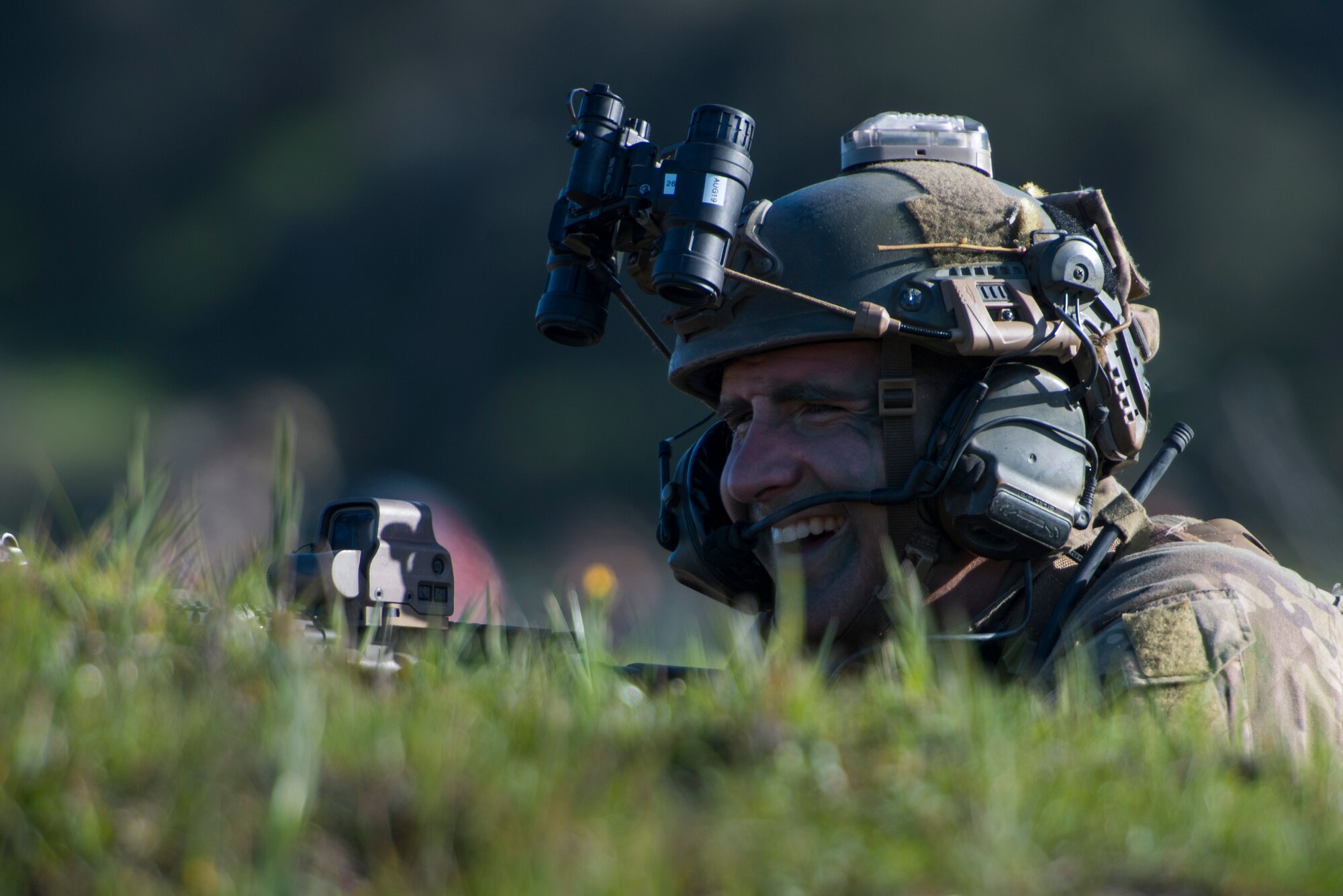 A pararescueman 58th Rescue Squadron, Nellis Air Force Base, Nev., laughs during Tiger Rescue IV, March 28, 2018, at Vandenberg Air Force Base, Calif. The four-day exercise challenged Airmen from multiple rescue squadrons to bring the capabilities of the personnel recovery triad together to successfully complete rescue missions and maintain proficiency. The three branches of the personnel recovery triad are the HC-130J Combat King II, HH-60G Pave Hawk and the guardian angel weapons system or pararescuemen. (U.S. Air Force photo by Senior Airman Janiqua P. Robinson)