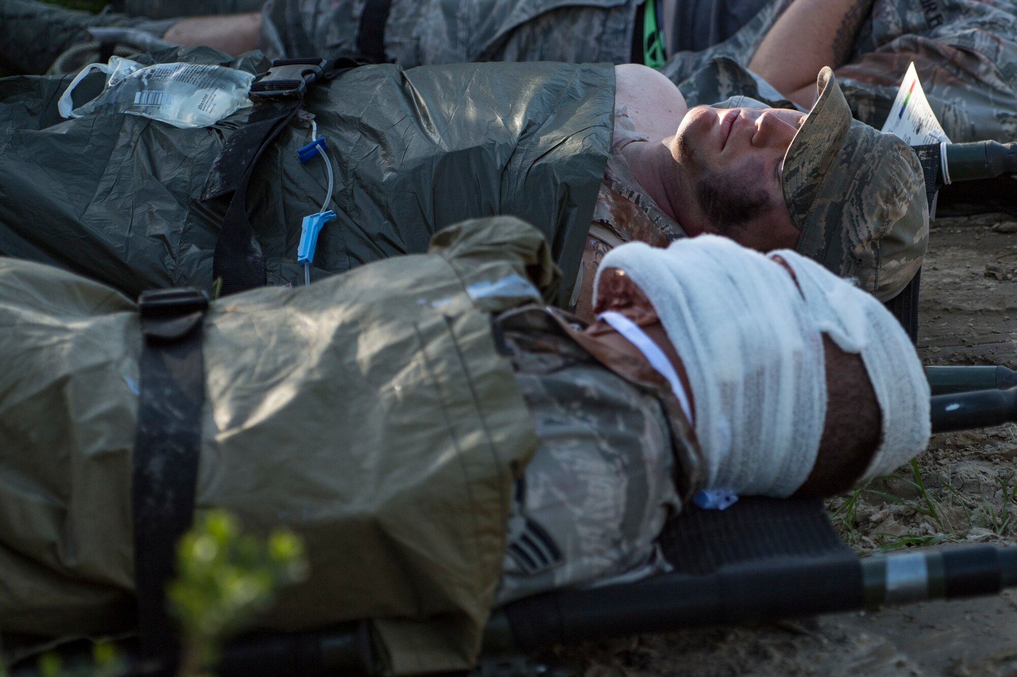 Simulated casualties rest on stretchers during Tiger Rescue IV, March 28, 2018, at Vandenberg Air Force Base, Calif. The four-day exercise challenged Airmen from multiple rescue squadrons to bring the capabilities of the personnel recovery triad together to successfully complete rescue missions and maintain proficiency. The three branches of the personnel recovery triad are the HC-130J Combat King II, HH-60G Pave Hawk and the guardian angel weapons system or pararescuemen. (U.S. Air Force photo by Senior Airman Janiqua P. Robinson)