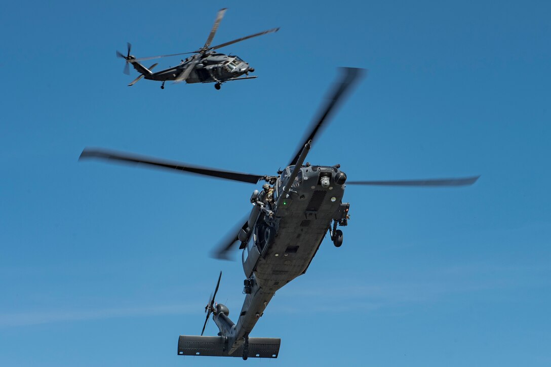 Two HH-60G Pave Hawk Helicopter aircrews from the 55th Rescue Squadron, Davis-Monthan Air Force Base, Ariz., prepare to land during Tiger Rescue IV, March 29, 2018, at Vandenberg Air Force Base, Calif. The four-day exercise challenged Airmen from multiple rescue squadrons to bring the capabilities of the personnel recovery triad together to successfully complete rescue missions and maintain proficiency. The three branches of the personnel recovery triad are the HC-130J Combat King II, HH-60G and the guardian angel weapons system or pararescuemen. (U.S. Air Force photo by Senior Airman Janiqua P. Robinson)