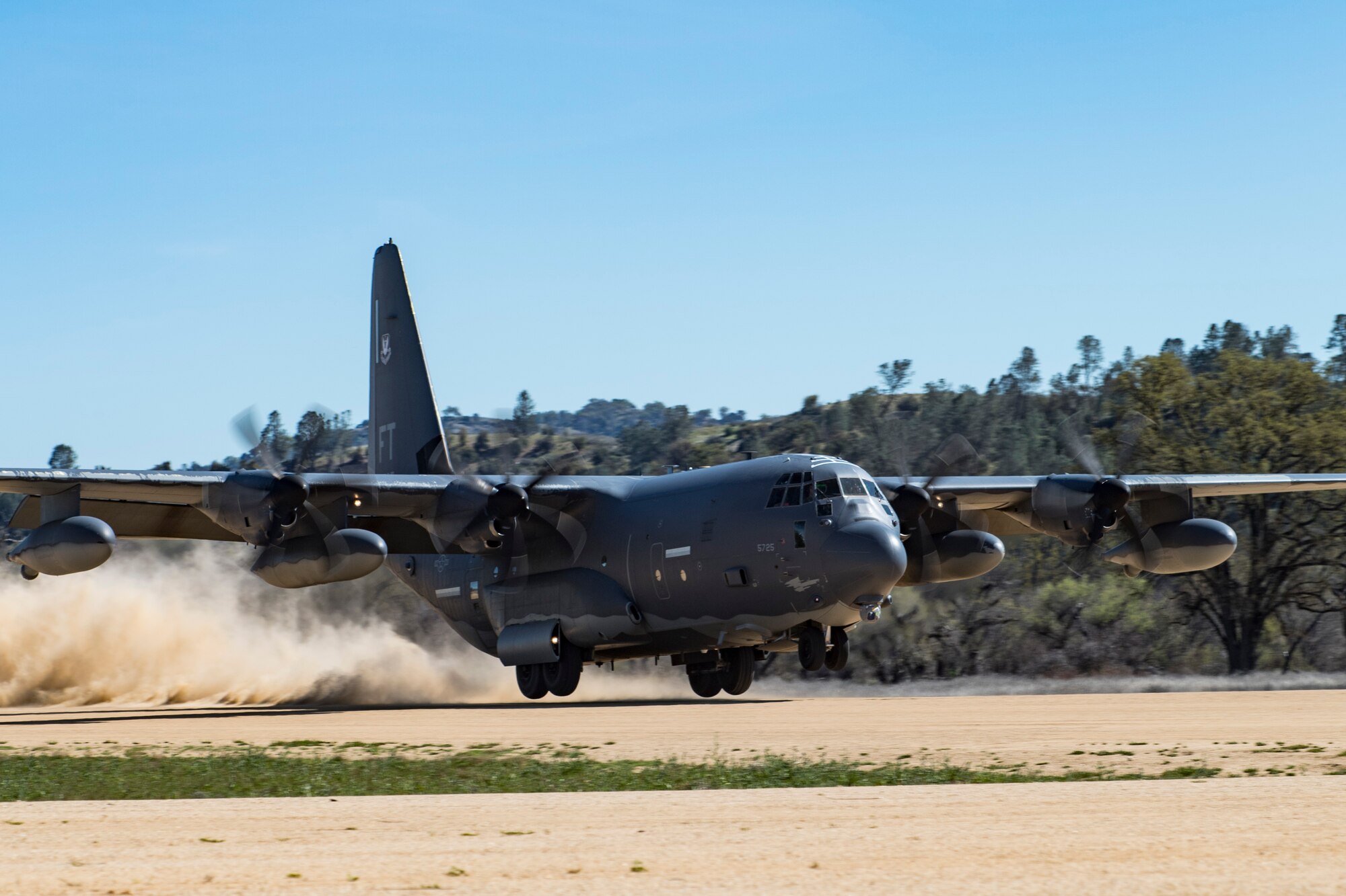 Aircrew within a HC-130J Combat King II from the from the 71st Rescue Squadron, Moody Air Force Base, Ga., performs an austere combat landing during Tiger Rescue IV, March 29, 2018, at Vandenberg Air Force Base, Calif. The four-day exercise challenged Airmen from multiple rescue squadrons to bring the capabilities of the personnel recovery triad together to successfully complete rescue missions and maintain proficiency. The three branches of the personnel recovery triad are the HC-130J, HH-60G Pave Hawk and the guardian angel weapons system or pararescuemen. (U.S. Air Force photo by Senior Airman Janiqua P. Robinson)
