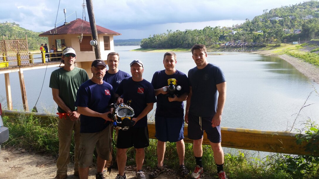 The USACE Technical Services Dive Team completed ROV and Dive Inspections at the Guajataca Dam in Puerto Rico from Feb. 26-28, 2017 in support of USACE Jacksonville District, repairs for FEMA to collect detailed facility conditions and measurements for upcoming repair work.

Team member order in the group shot are (L-R) Andrew Hannes, Mike Draganac, Dave Bala, Shanon Chader, Weston Cross, Brian Dockstader. (Photo by Dave Mastriano, Jacksonville District)