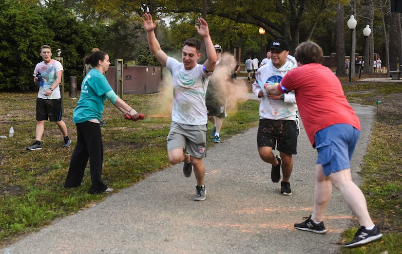 Participants in the Sexual Assault Awareness Prevention and Response color run get covered in different colors at Joint Base Charleston, S.C, March 30, 2018.
