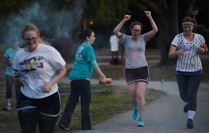 Participants in the Sexual Assault Awareness Prevention and Response color run get covered in different colors at Joint Base Charleston, S.C, March 30, 2018.