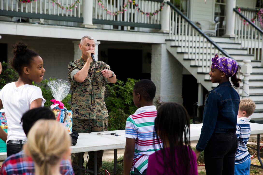 Lt. Gen. Rex C. McMillian, commander of Marine Forces Reserve and Marine Forces North, leads a game of “General Says” at his historic home during the MARFORRES command sponsored Easter Egg Hunt, New Orleans, March 24, 2018. Families from the local community were invited to attend the event, interact with the service members and celebrate the holiday together. (U.S. Marine Corps photo by Sgt. Melissa Martens)