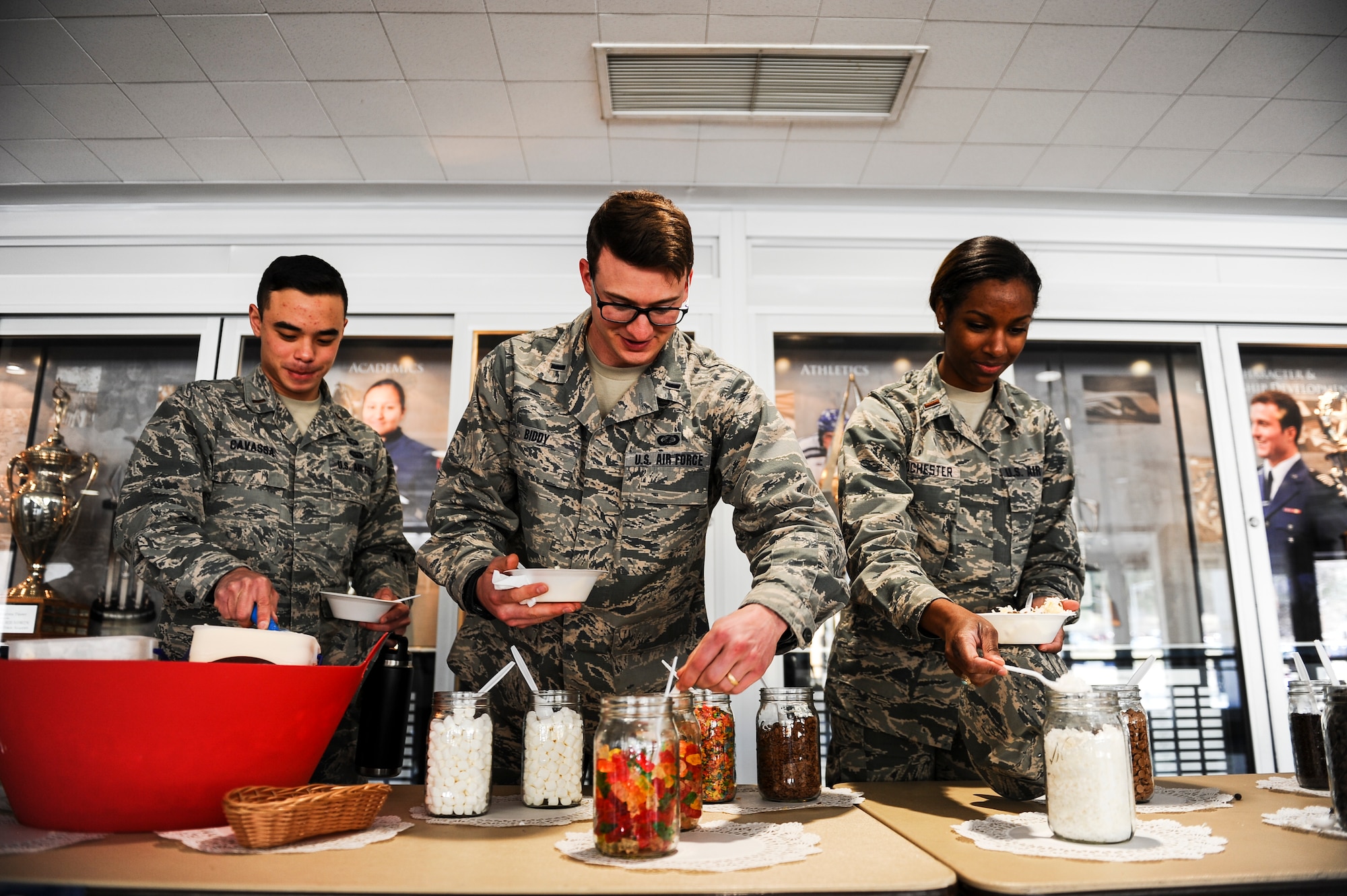 Airmen enjoy the Air Force Assistance Fund campaign’s ice cream social April 3, 2018, at Air Force Academy, Colorado. For 45 years, the campaign has evolved into supporting the Air Force Aid Society, Air Force Enlisted Village, Air Force Villages Charitable Foundation and the General and Mrs. Curtis E. LeMay Foundation. (U.S. Air Force photo/Tech. Sgt. Julius Delos Reyes)