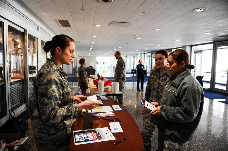 Capt. Alicia Hogan, 10th Medical Group, explains the Air Force Assistance Fund to Airmen during the campaign’s ice cream social April 3, 2018, at Air Force Academy, Colorado. The Academy kicked off its AFAF campaign April 2. (U.S. Air Force photo/Tech. Sgt. Julius Delos Reyes)