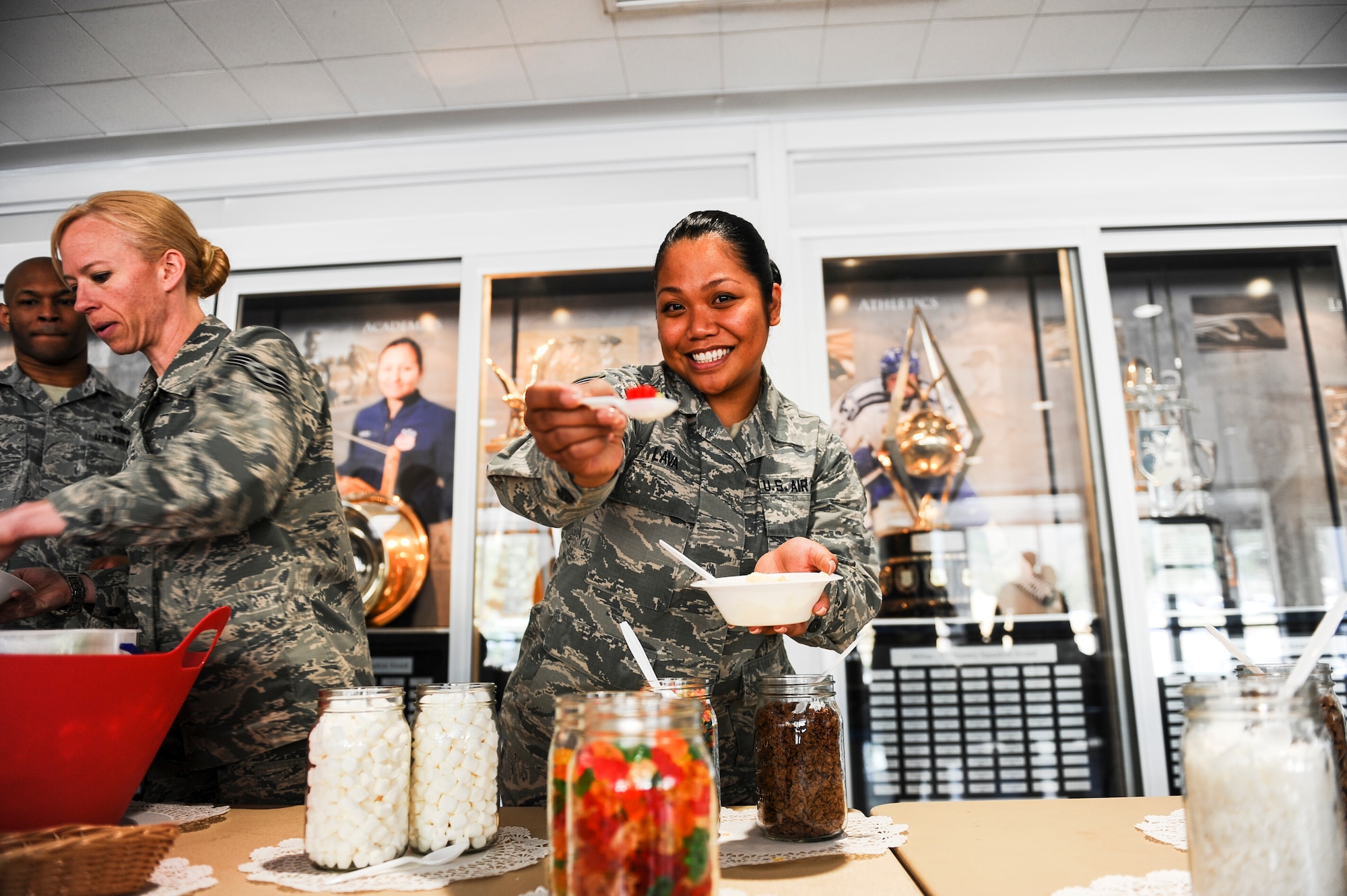 Staff Sgt. Khacy Lava, Headquarters Air Force Academy, enjoys her ice cream during the Air Force Assistance Fund campaign’s ice cream social April 3, 2018, at Air Force Academy, Colorado. The campaign is an annual effort to raise funds for the charitable affiliates that provide support to our Air Force family in need, including active duty, retirees, reservists, Guard members and our dependents including surviving spouses. (U.S. Air Force photo/Tech. Sgt. Julius Delos Reyes)