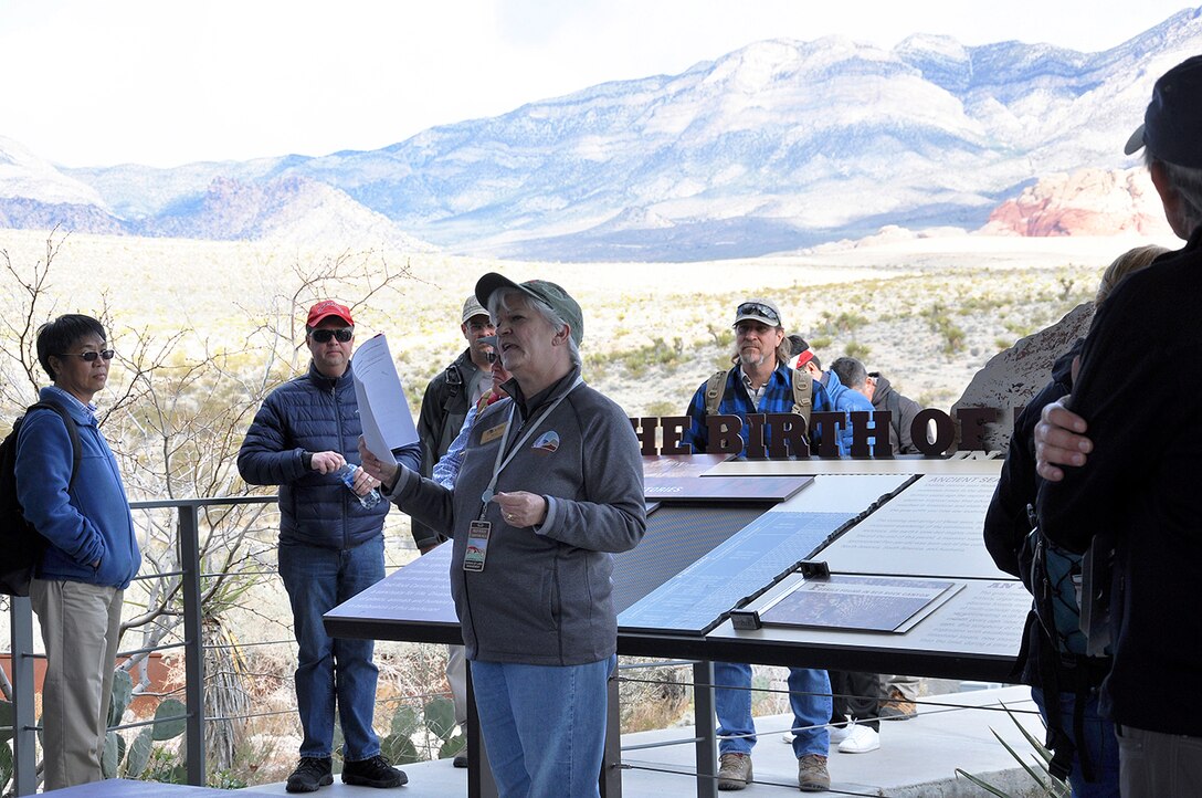 Margie Klein, interpretive naturalist with the Red Rock Canyon Visitor’s Center, gives an overview of Red Rock Canyon National Conservation Area to U.S. Army Corps of Engineers geologists before the group heads out to participate in a paleoflood exercise and hike the Keystone Thrust Fault trail March 15 at the conservation area near Las Vegas.