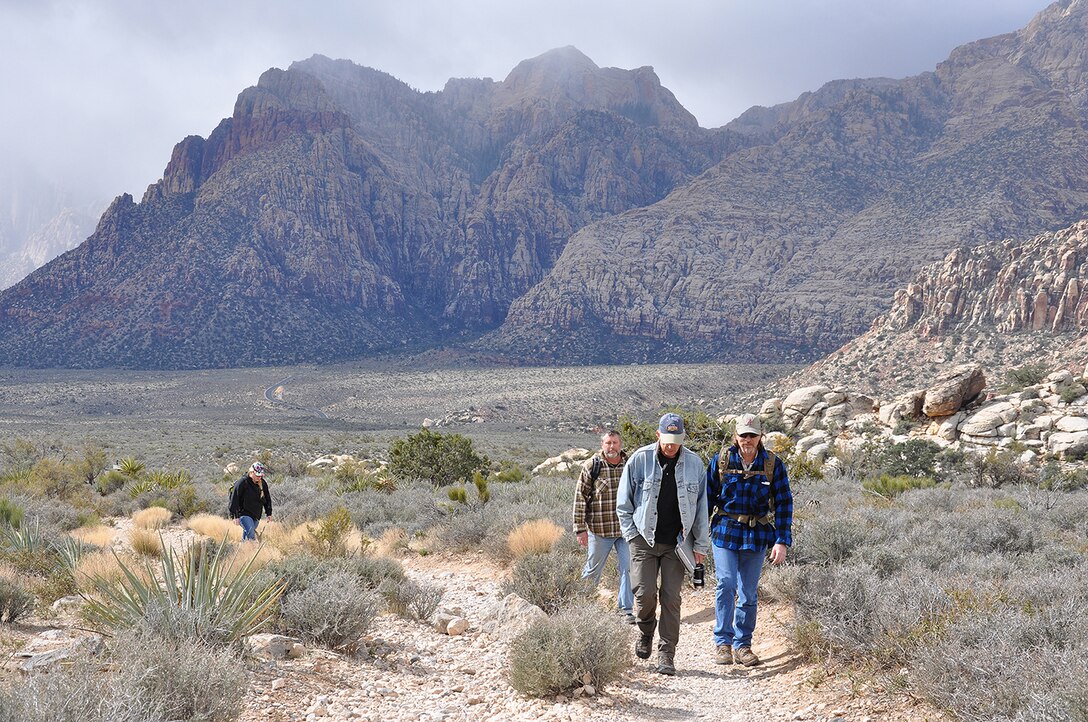 U.S. Army Corps of Engineers geologists and technicians from across the nation, including Keith Kelson, center left, who conducted a paleoflood exercise with the group, hike the Keystone Thrust Fault trail March 15 in the Red Rock Canyon National Conservation Area near Las Vegas.