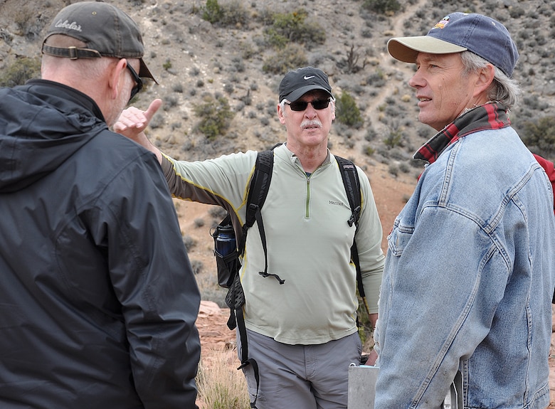 Doug Bliss, chief of the Geotechnical and Engineering Services Branch, Regional Geotechnical Center, with the U.S. Army Corps of Engineers’ Alaska District, center, discusses the Keystone Thrust Fault with Keith Kelson, engineering geologist with the Corps’ Sacramento District, right, and another geologist during a hike of the fault March 15 at Red Rock Canyon National Conservation Area.