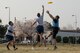 Opposing team members reach for the disk during an ultimate frisbee match, March 28, 2018, at Yokota Air Base, Japan.