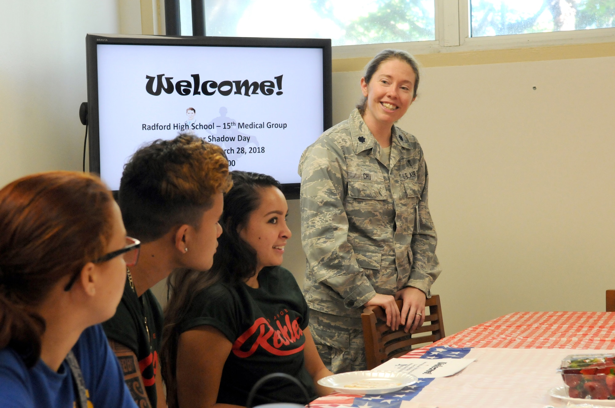 Lt. Col. Kasi M. Chu, 15th Medical Operations Squadron staff physician, welcomes students from Radford High School to Career Shadow Day at the 15th Medical Group, Joint Base Pearl Harbor-Hickam, Hawaii, March 28, 2018.