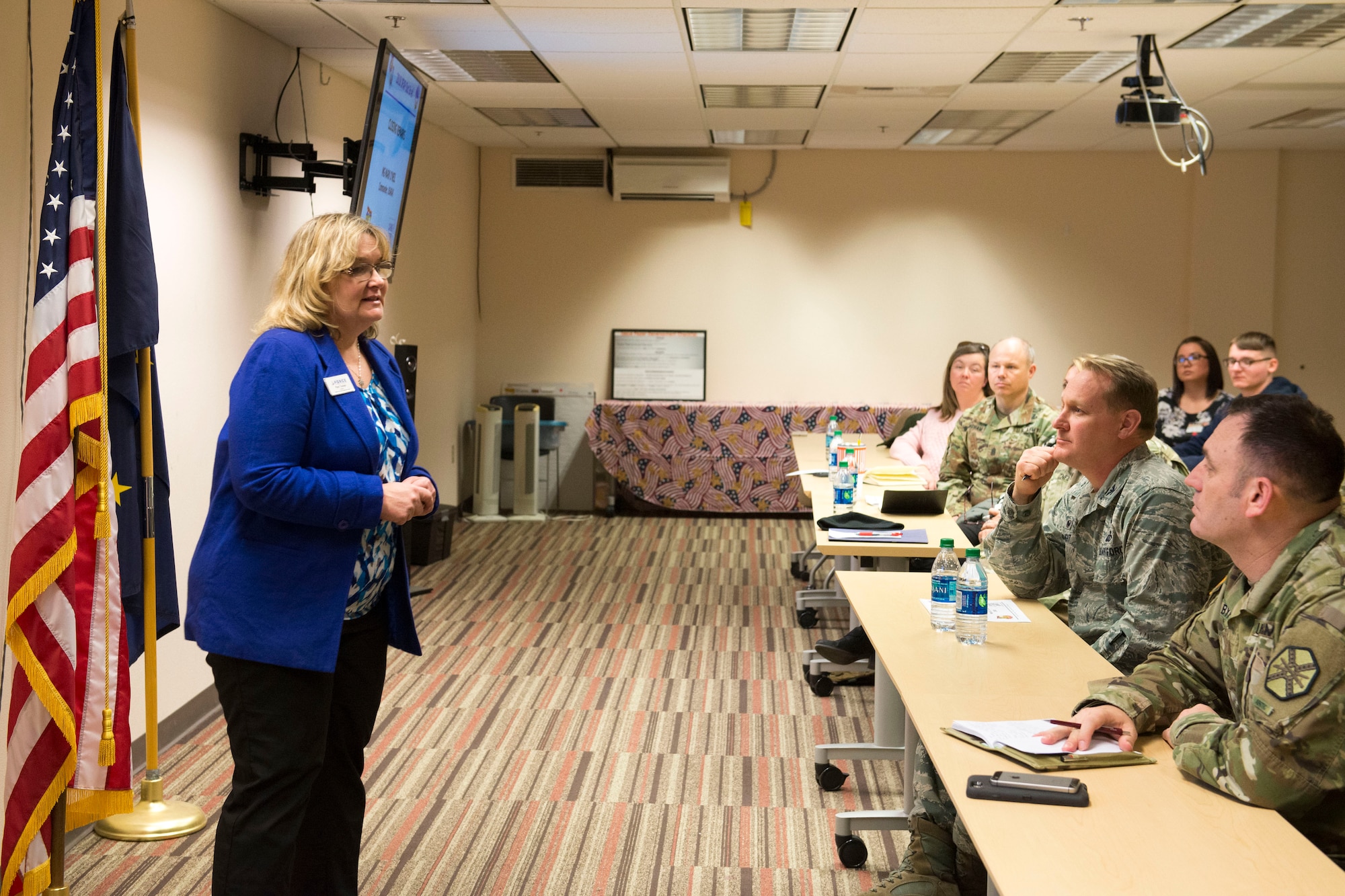 Pamela Tucker, Family Support Center Director, addresses attendees during the out-brief portion of the Joint Family Action Plan Conference March 27, 2018, at Joint Base Elmendorf-Richardson, Alaska. JFAP provides the Joint Base Elmendorf-Richardson community with a direct line to leadership through an annual conference hosted by the Military Family Readiness Center.