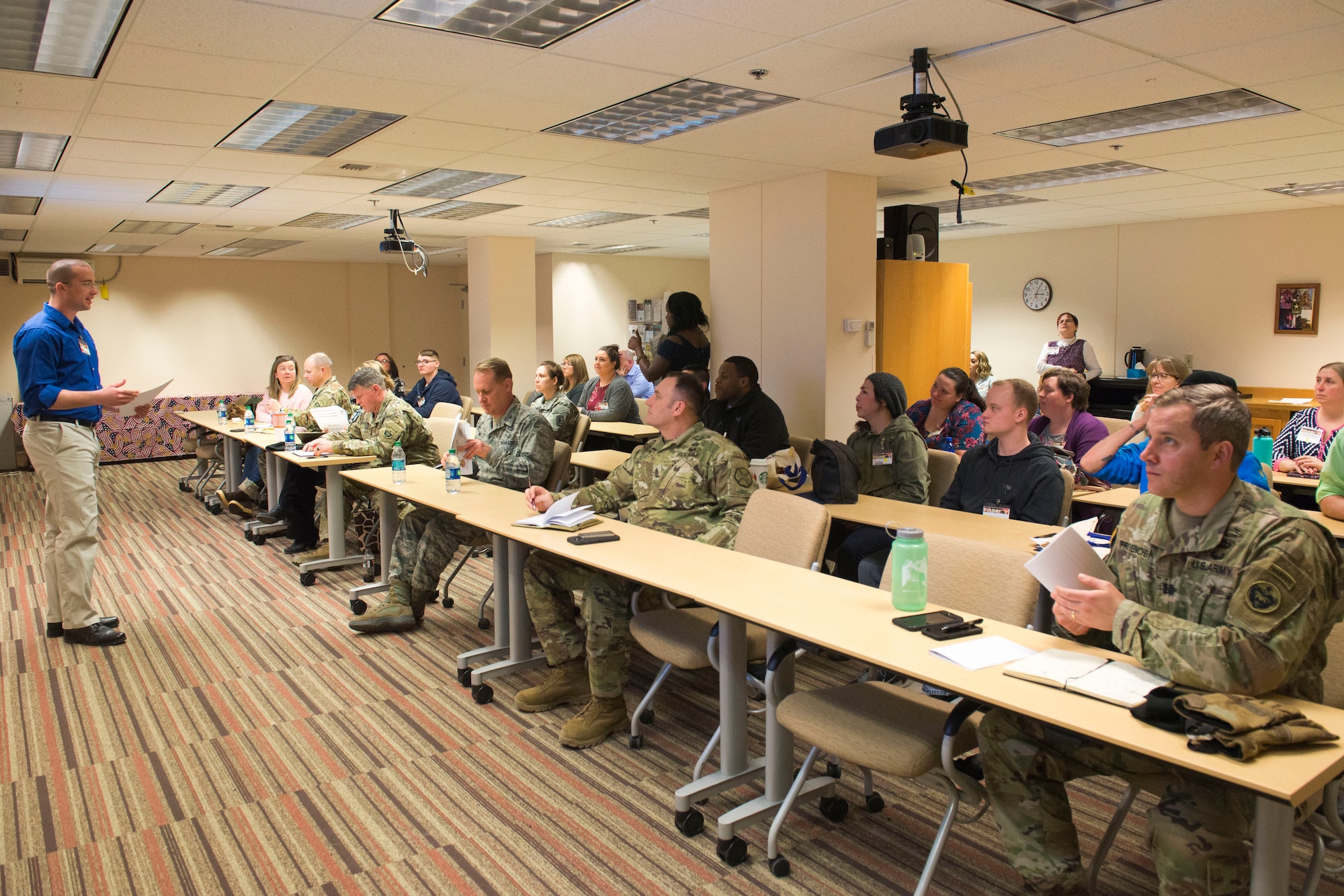 Tech. Sgt. Timothy Ferber, a 673d Mission Support Group active-duty delegate, presents submitted issues to higher command during the out-brief portion of the Joint Family Action Plan Conference March 27, 2018, at Joint Base Elmendorf-Richardson, Alaska. JFAP provides the JBER community with a direct line to leadership through an annual conference hosted by the Military Family Readiness Center.