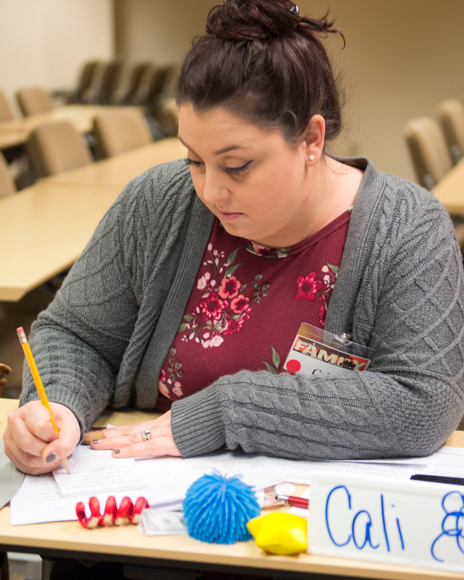 Cali McDermott, conference delegate and active-duty spouse, writes a title for an issue being addressed for the Joint Family Action Plan Conference March 27, 2018, at Joint Base Elmendorf-Richardson, Alaska. JFAP provides the JBER community with a direct line to leadership through an annual conference hosted by the Military Family Readiness Center.