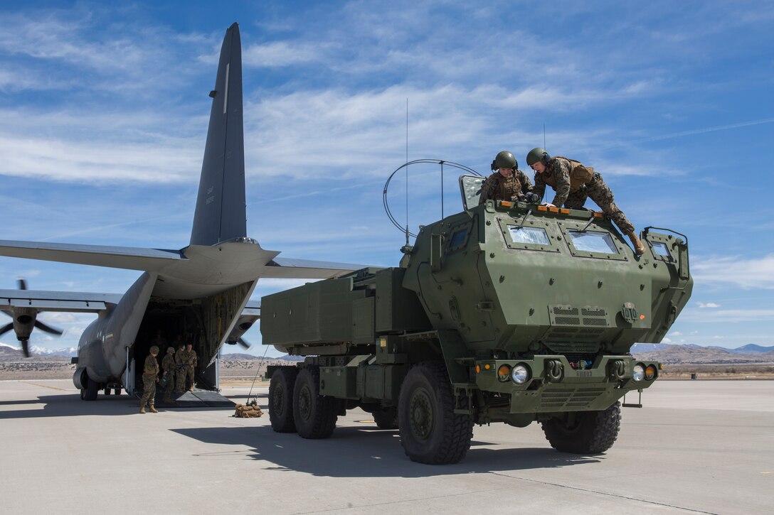 Marines from Kilo Battery, 2nd Battalion, 14th Marine Regiment, reassemble an M142 High Mobility Artillery Rocket System (HIMARS) after being transported on an Air Force MC-130, at Dugway Proving Grounds, Utah, March 30, 2018. Marines from Kilo Battery flew from Fort Campbell, Ky., to Dugway where they offloaded and fired four HIMARS missiles, demonstrating a unique capability that will give commanders more options to deal with threats when other options are not appropriate. (Marine Corps photo by Lance Cpl. Niles Lee)