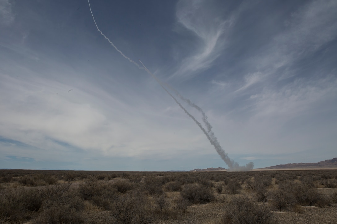 A Marine Corps M142 High Mobility Artillery Rocket System (HIMARS) from Kilo Battery, 2nd Battalion, 14th Marine Regiment, fires two missiles, at Dugway Proving Grounds, Utah, March 30, 2018. Marines from Kilo Battery flew from Fort Campbell, Ky., to Dugway where they offloaded and fired four HIMARS missiles, demonstrating a unique capability that will give commanders more options to deal with threats when other options are not appropriate. (Marine Corps photo by Lance Cpl. Niles Lee)