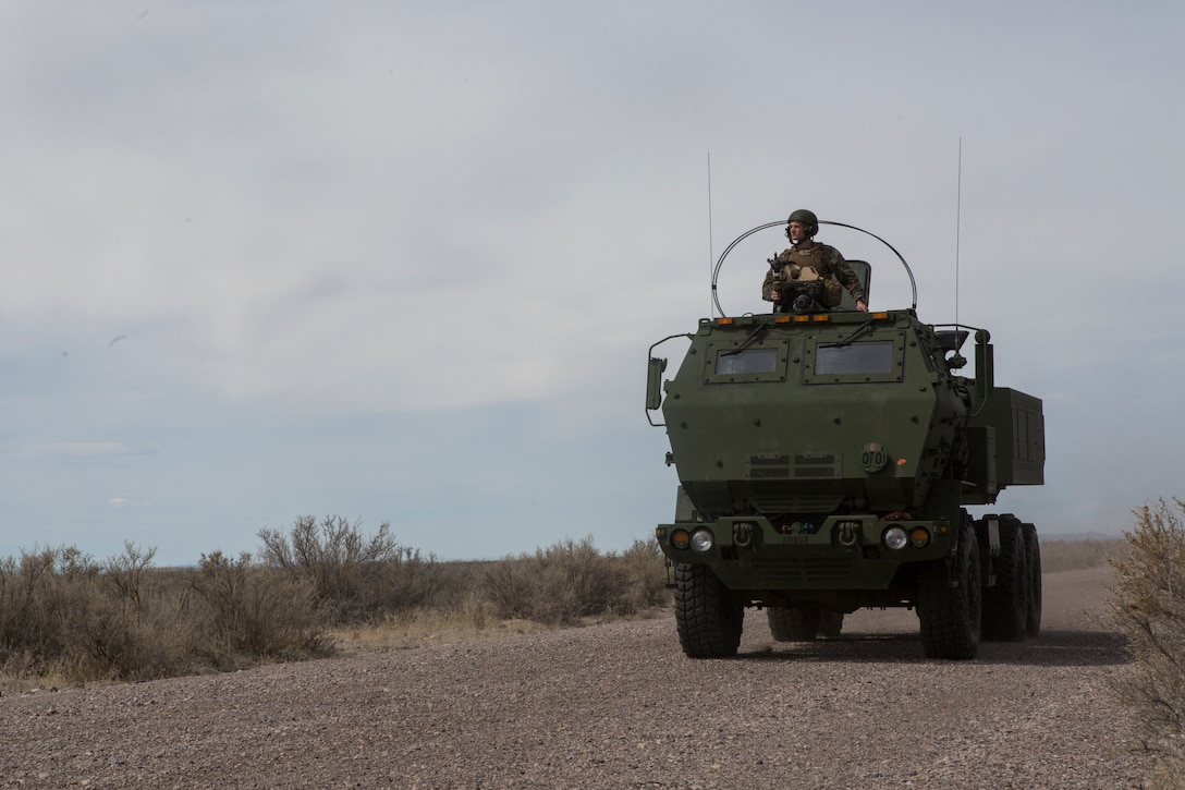 A Marine Corps M142 High Mobility Artillery Rocket System (HIMARS) returns to an airstrip after a fire mission, at Dugway Proving Grounds, Utah, March 30, 2018. Marines from Kilo Battery flew from Fort Campbell, Ky., to Dugway where they offloaded and fired four HIMARS missiles, demonstrating a unique capability that will give commanders more options to deal with threats when other options are not appropriate. (Marine Corps photo by Lance Cpl. Niles Lee)