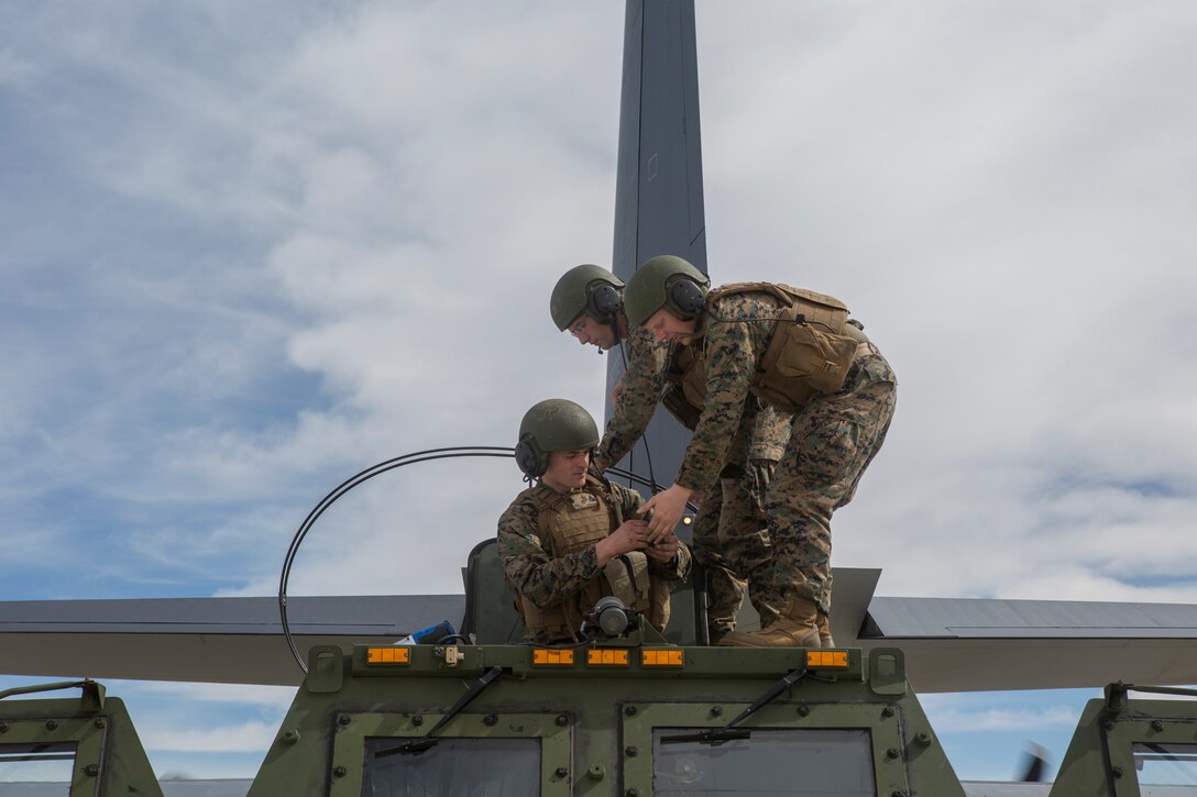 Marines from Kilo Battery, 2nd Battalion, 14th Marine Regiment, disassemble an M142 High Mobility Artillery Rocket System (HIMARS) in preparations for transport on an Air Force MC-130, at Dugway Proving Grounds, Utah, March 30, 2018. Marines from Kilo Battery flew from Fort Campbell, Ky., to Dugway where they offloaded and fired four HIMARS missiles, demonstrating a unique capability that will give commanders more options to deal with threats when other options are not appropriate. (Marine Corps photo by Lance Cpl. Niles Lee)