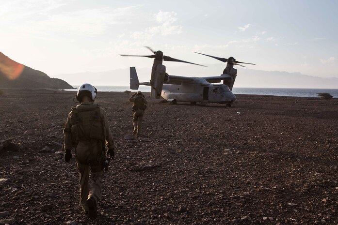 180402-M-WP334-0064 ARTA BEACH, Djibouti (April 2, 2018) U.S. Marine Corps Lance Cpl. Bailey Quinn, left, and Cpl. Ryan Rowe, both MV-22B Osprey crew chiefs assigned to Marine Medium Tiltrotor Squadron (VMM) 162 (Reinforced), 26th Marine Expeditionary Unit, prepare to board an MV-22B Osprey during Alligator Dagger in Arta Range, Djibouti, April 2, 2018. Led by Naval Amphibious Force, Task Force 51/5th Marine Expeditionary Brigade, Alligator Dagger integrates U.S. Navy and Marine Corps assets to practice and rehearse a range of critical capabilities available to U.S. Central Command both afloat and ashore to promote stability and security in the region.