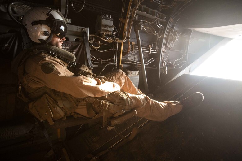 180402-M-WP334-0069 U.S. 5TH FLEET AREA OF OPERATIONS (April 2, 2018) U.S. Marine Corps Lance Cpl. Bailey Quinn, an MV-22B Osprey crew chief assigned to Marine Medium Tiltrotor Squadron (VMM) 162 (Reinforced), 26th Marine Expeditionary Unit, takes in the view from inside an MV-22B Osprey during Alligator Dagger, April 2, 2018. Led by Naval Amphibious Force, Task Force 51/5th Marine Expeditionary Brigade, Alligator Dagger integrates U.S. Navy and Marine Corps assets to practice and rehearse a range of critical capabilities available to U.S. Central Command both afloat and ashore to promote stability and security in the region.