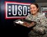 Female Air Force service member posing for a photo at the installation USO.