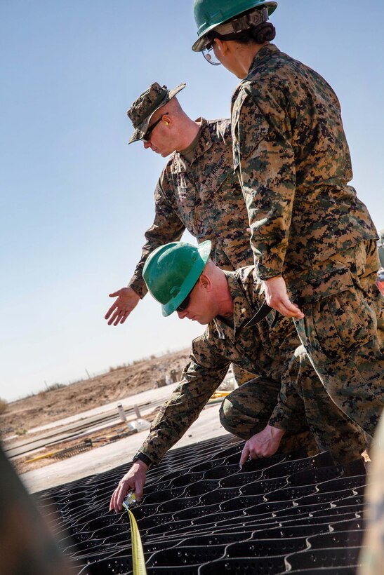 Marines conduct airfield damage repair operations.