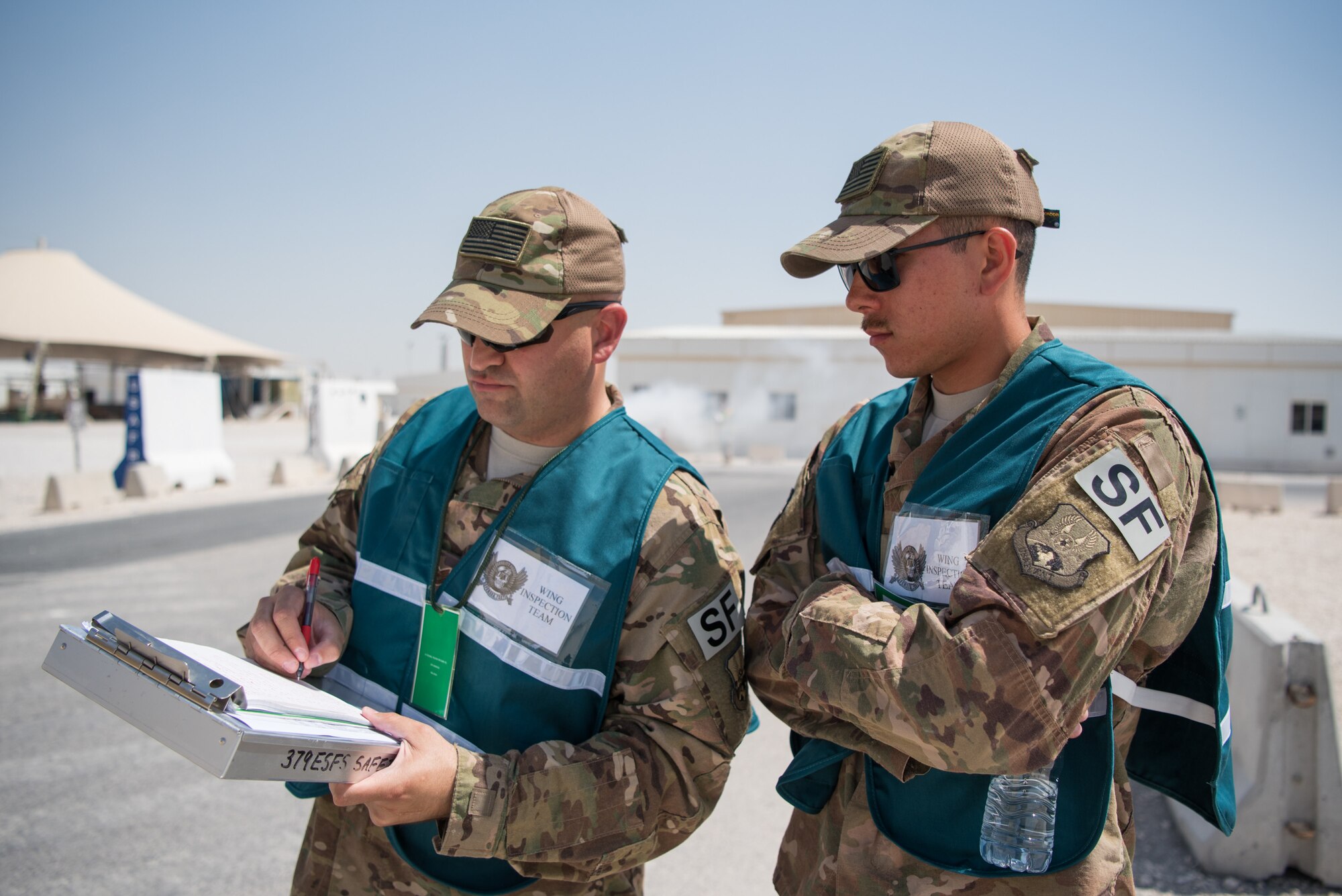 Airmen from the 379th Air Expeditionary Wing and coalition partners conduct an attack notification response exercise at Al Udeid Air Base, Qatar, March 22, 2018. The scenario, commenced in a realistic and unanticipated manner, was designed to improve physical and procedural security as well as warning and alert notification capabilities. (U.S. Air Force photo by Staff Sgt. Joshua Horton)