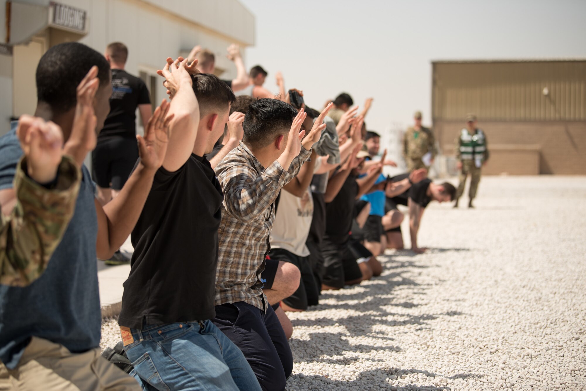 Airmen from the 379th Air Expeditionary Wing conduct an attack notification response exercise at Al Udeid Air Base, Qatar, March 22, 2018. The scenario, commenced in a realistic and unanticipated manner, was designed to improve physical and procedural security as well as warning and alert notification capabilities. (U.S. Air Force photo by Staff Sgt. Joshua Horton)