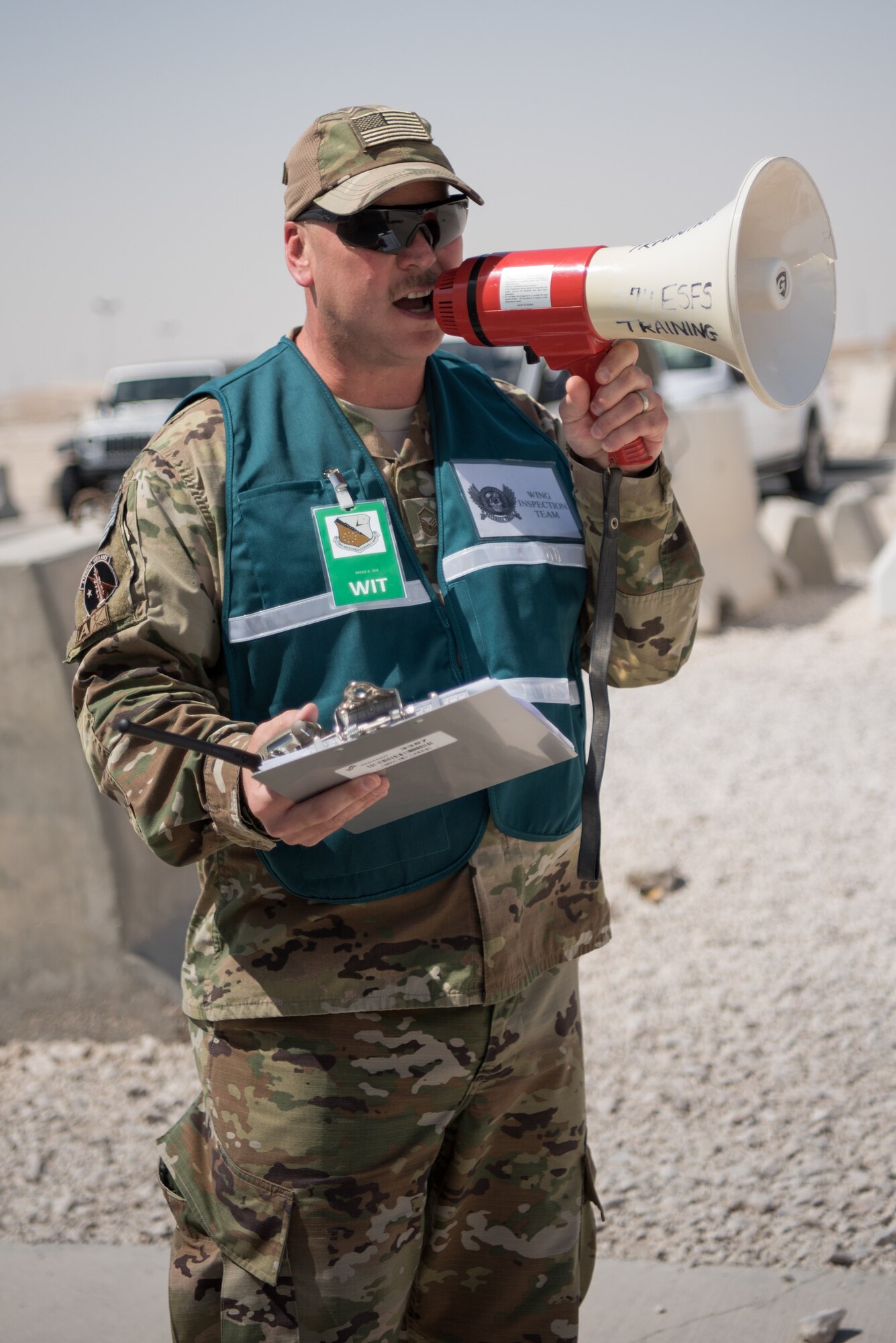 Airmen from the 379th Air Expeditionary Wing and coalition partners conduct an attack notification response exercise at Al Udeid Air Base, Qatar, March 22, 2018. The scenario, commenced in a realistic and unanticipated manner, was designed to improve physical and procedural security as well as warning and alert notification capabilities. (U.S. Air Force photo by Staff Sgt. Joshua Horton)