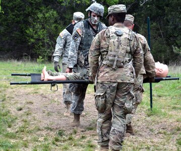 Army 1st Lt. Devon Furey, masters one of three warrior skills tasks on combat testing lane one March 26 at Joint Base San Antonio-Camp Bullis during Expert Field Medical Badge testing.