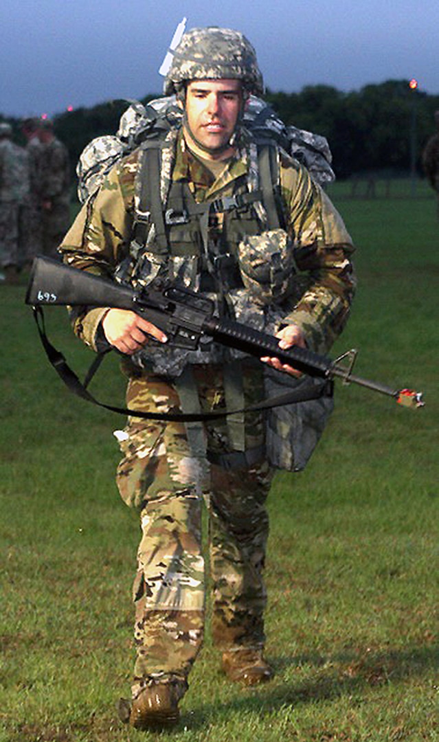 Army Capt. Paul Rosbrook, Company B, 187th Medical Battalion, completes the foot march during Expert Field Medical Badge testing March 28 at Joint Base San Antonio-Camp Bullis. Rosbrook received the highest score on the written test.